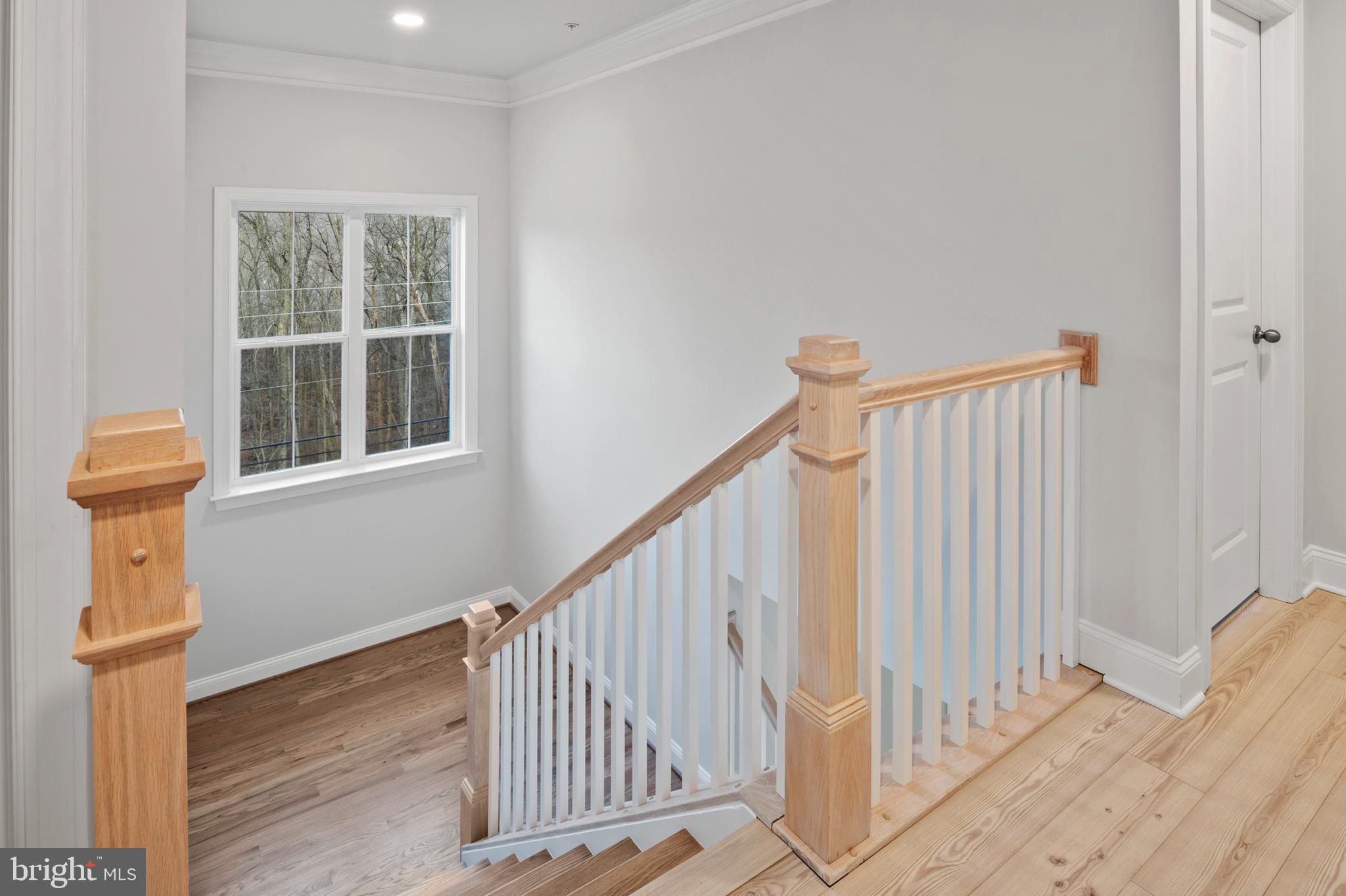 4496 Ilchester Road Ellicott City, MD 21043 - Photo 26 of 61 a view of staircase with white walls and a window