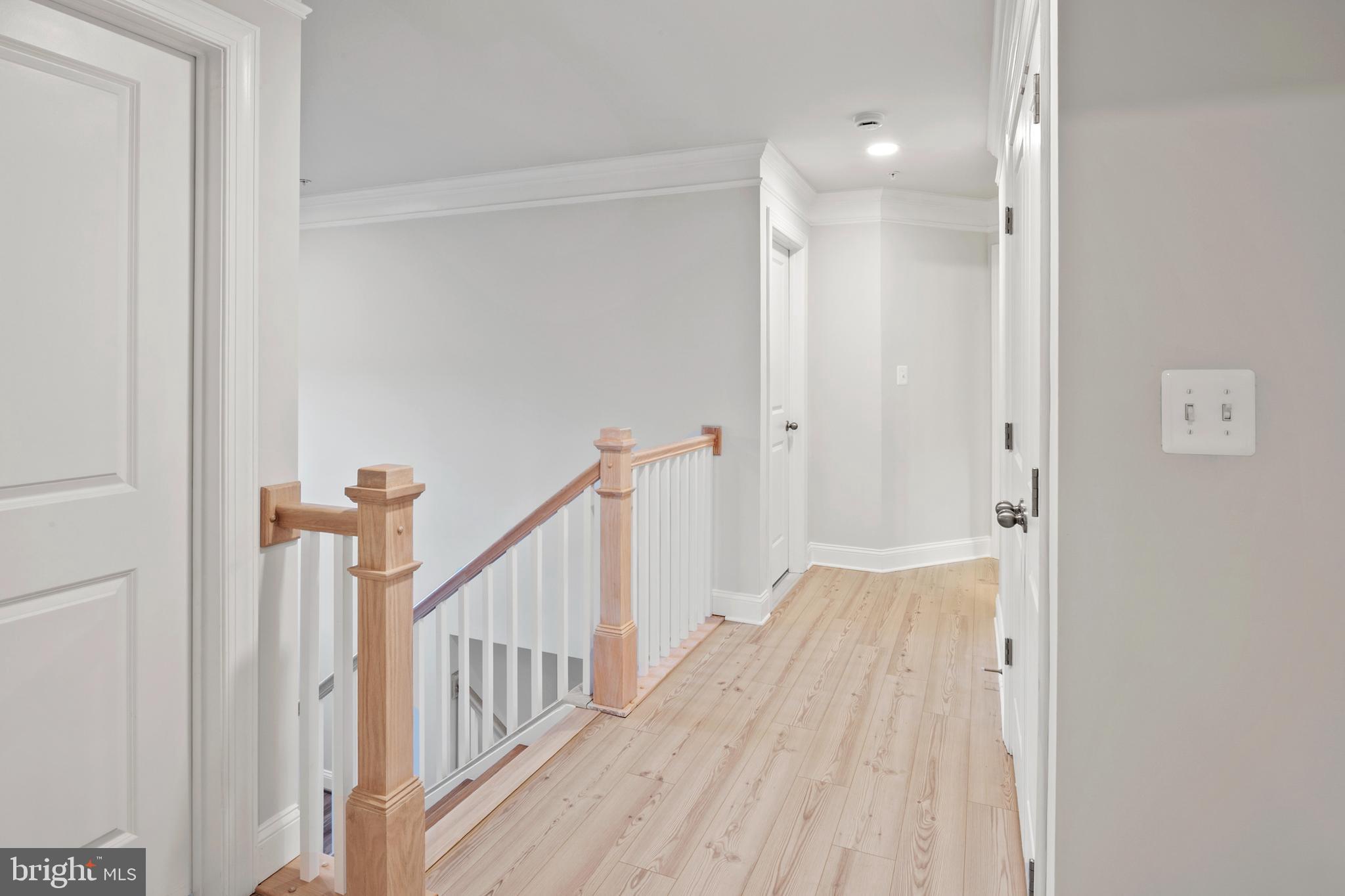 4496 Ilchester Road Ellicott City, MD 21043 - Photo 27 of 61 a view of a hallway with wooden floor and entryway