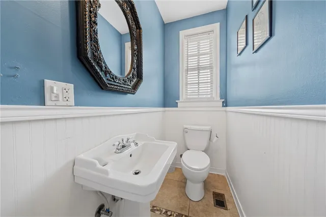 a bathroom with a toilet and a sink