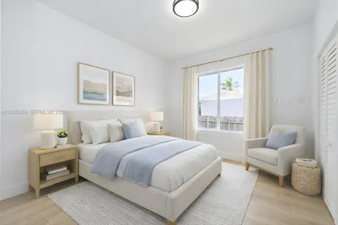 a bedroom with a bed and a couch