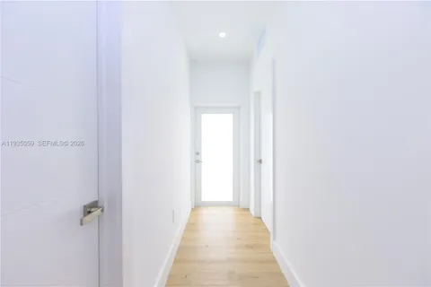 a view of a hallway with a white walls
