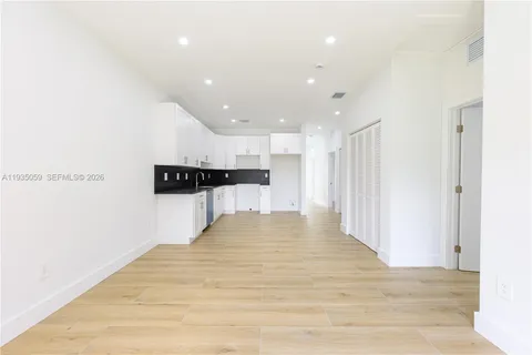 a view of kitchen and a window