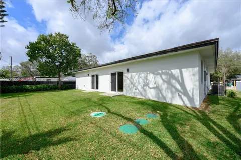 a backyard of a house with lots of green space