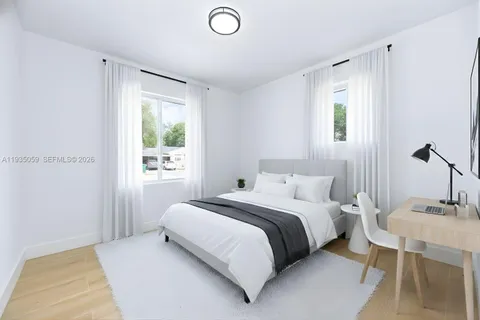 a bedroom with a bed and a table