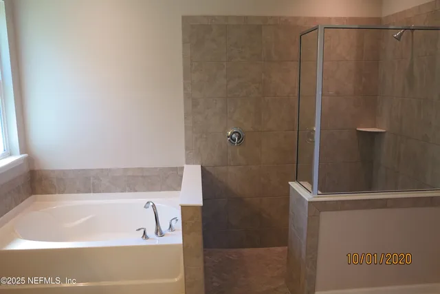 a bedroom with a bed and a table