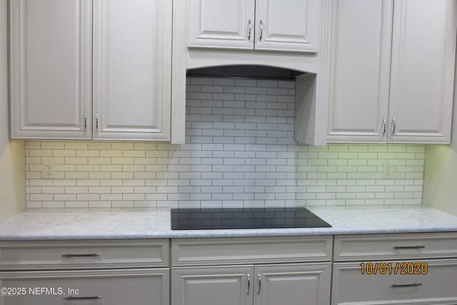 a kitchen with stainless steel appliances granite countertop a refrigerator sink and cabinets