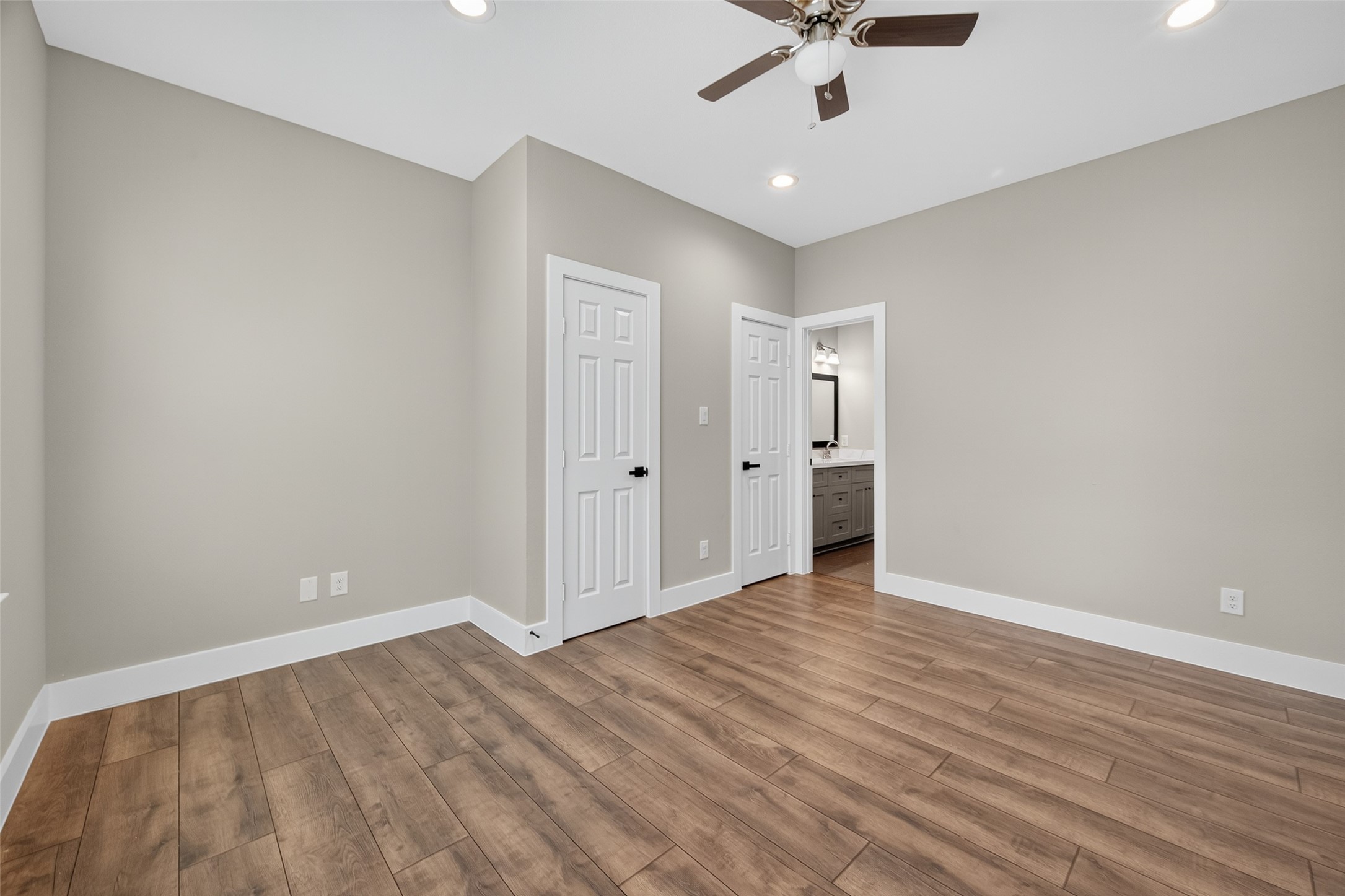 2109 Marnel Road, Unit H Houston, TX 77055 - Photo 9 of 30 wooden floor in an empty room with a window