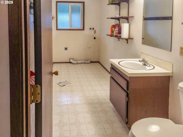 a bathroom with a sink and mirror