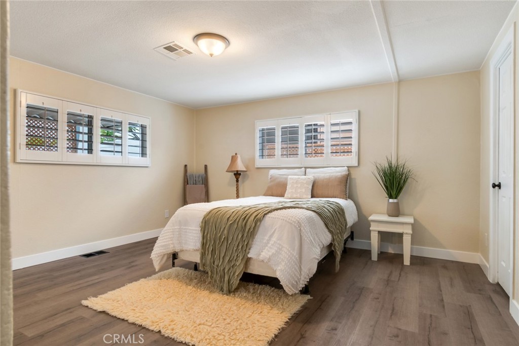 10210 Base Line Road, Unit 115 Rancho Cucamonga, CA 91701 - Photo 14 of 23 a bedroom with a bed and window
