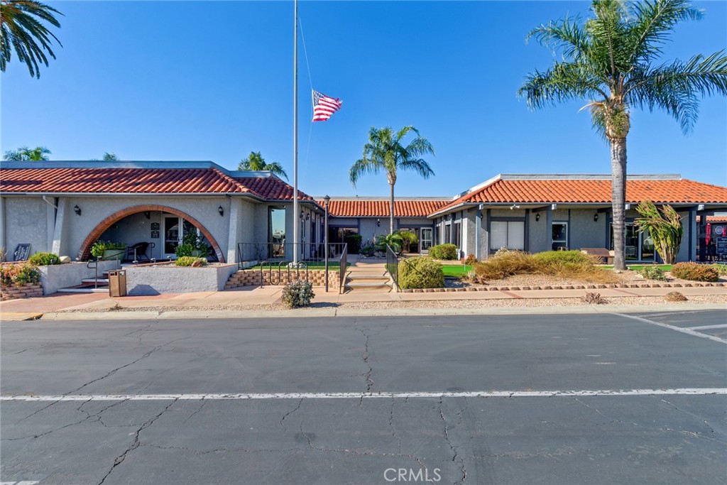 10210 Base Line Road, Unit 115 Rancho Cucamonga, CA 91701 - Photo 20 of 23 a view of pool with a table and chairs under an umbrella