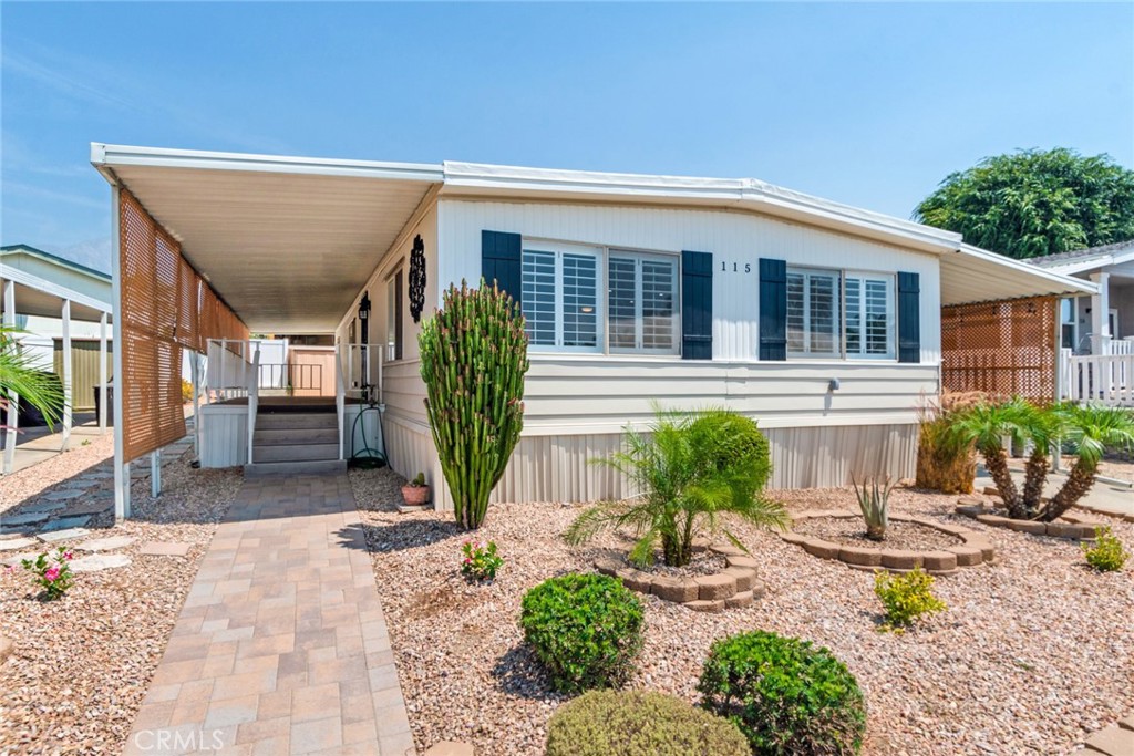 10210 Base Line Road, Unit 115 Rancho Cucamonga, CA 91701 - Photo 2 of 23 a front view of a house with garden