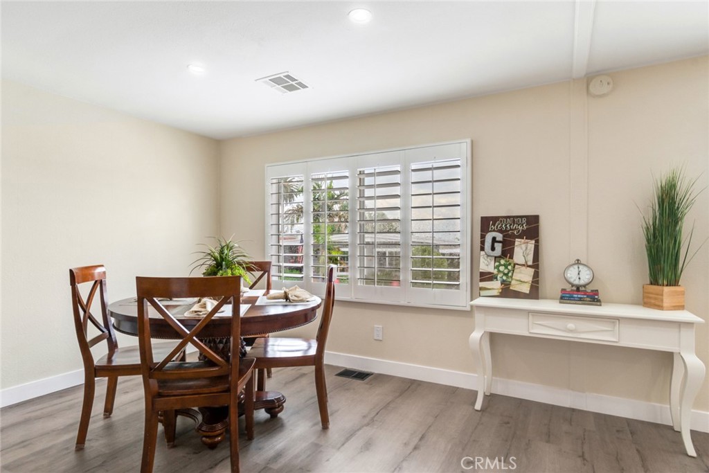 10210 Base Line Road, Unit 115 Rancho Cucamonga, CA 91701 - Photo 6 of 23 a dining room with furniture and large windows