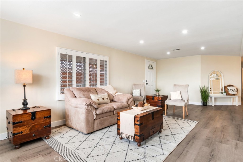 10210 Base Line Road, Unit 115 Rancho Cucamonga, CA 91701 - Photo 7 of 23 a living room with furniture and a window