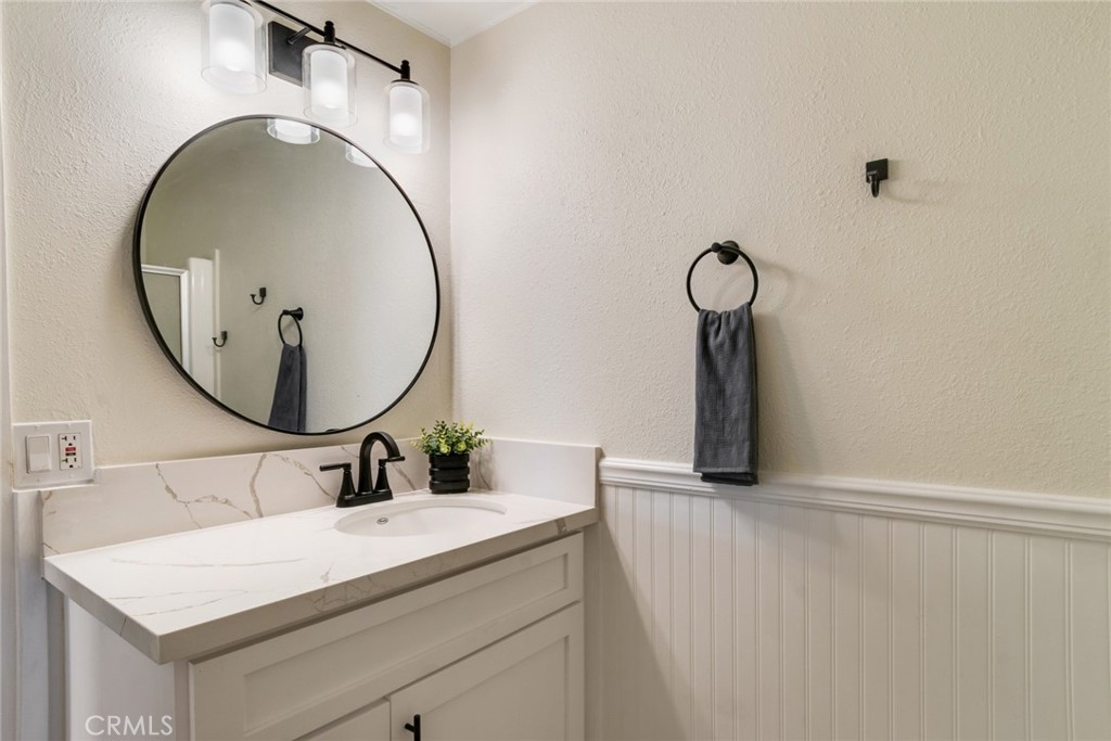 10210 Base Line Road, Unit 115 Rancho Cucamonga, CA 91701 - Photo 9 of 23 a bathroom with a sink and a mirror