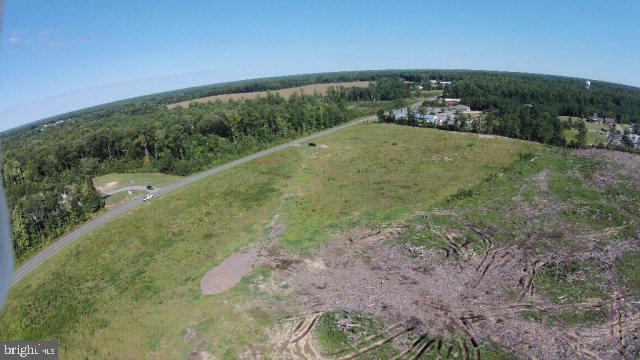 Parcels Harris Road Kilmarnock, VA 22482 - Photo 2 of 8 a view of a yard with a wooden fence