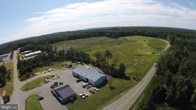 an aerial view of a residential houses with outdoor space