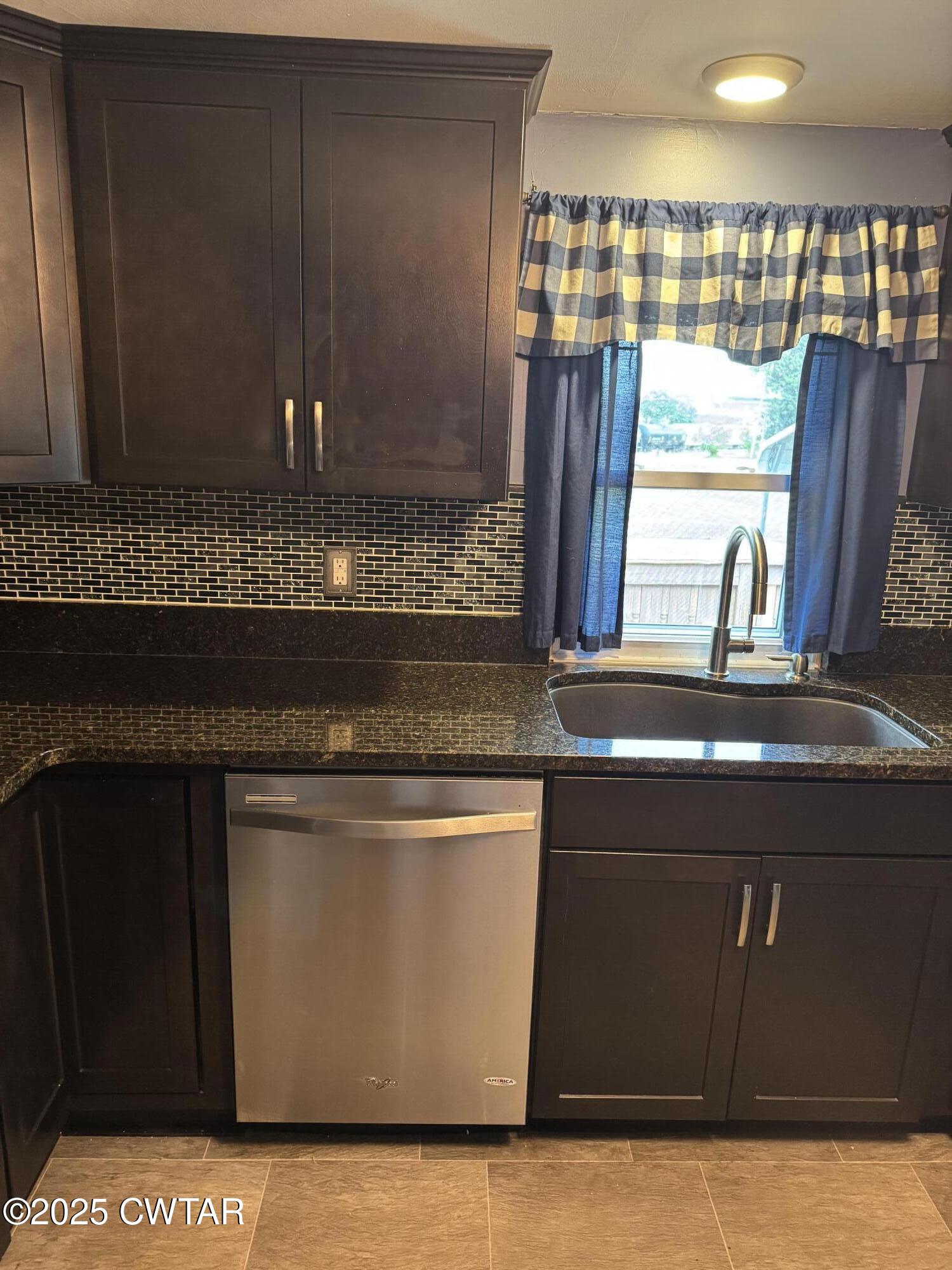 154 North Winchester Street McKenzie, TN 38201 - Photo 19 of 24 a close view of kitchen countertops with fireplace