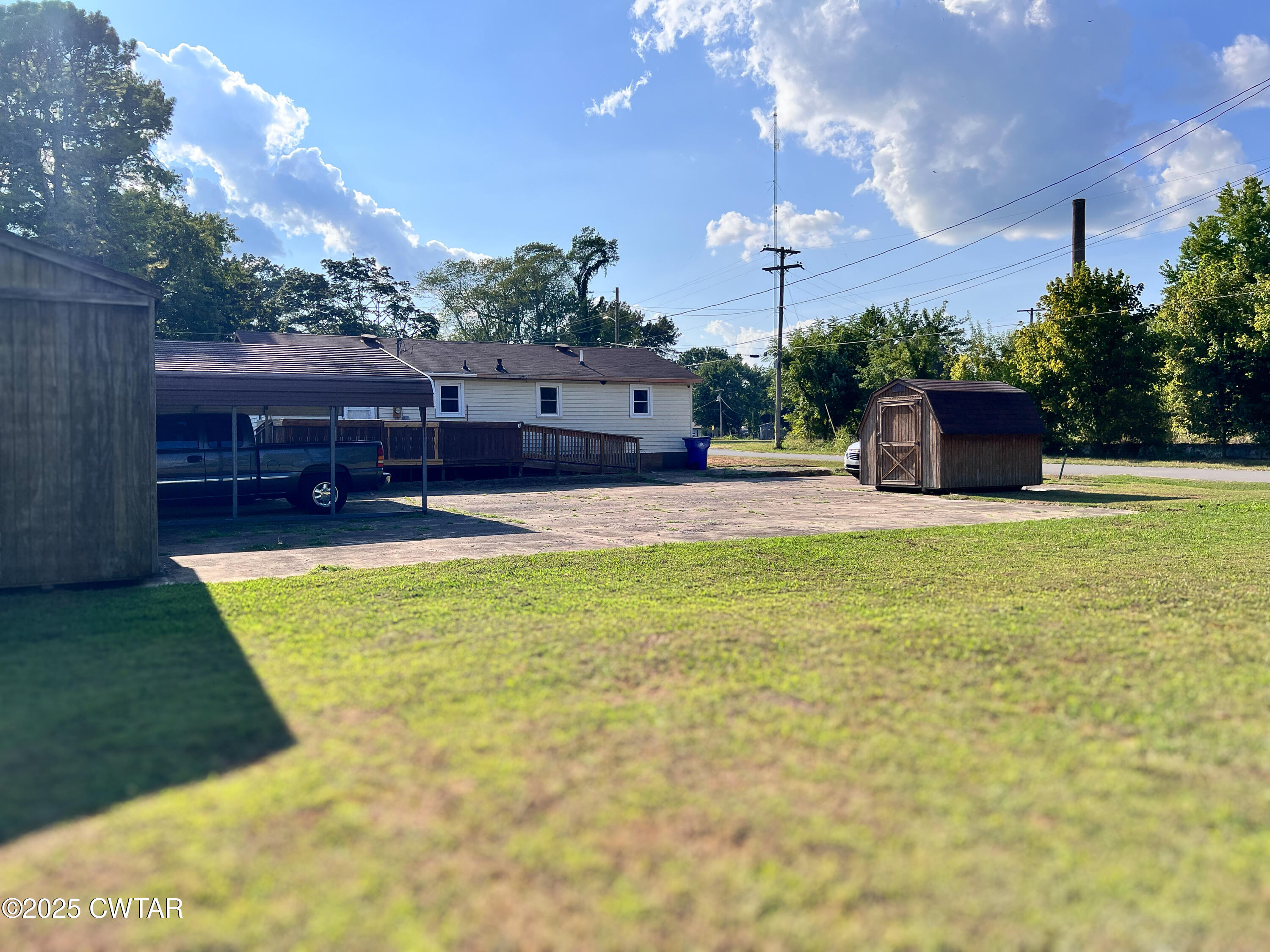 154 North Winchester Street McKenzie, TN 38201 - Photo 23 of 24 a swimming pool with outdoor seating and yard
