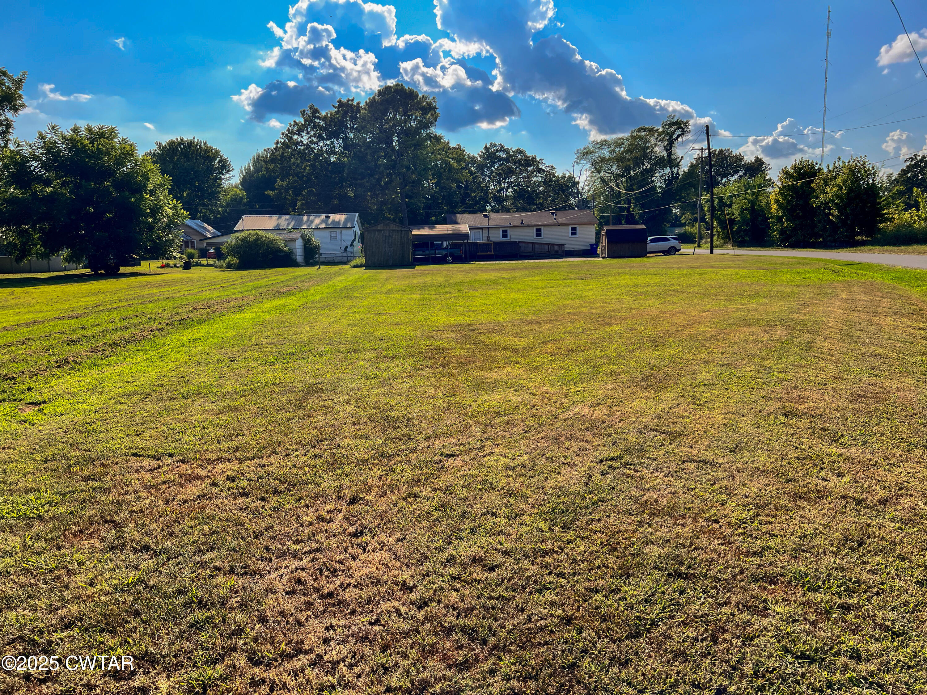 154 North Winchester Street McKenzie, TN 38201 - Photo 24 of 24 a view of a swimming pool with an outdoor space and seating area