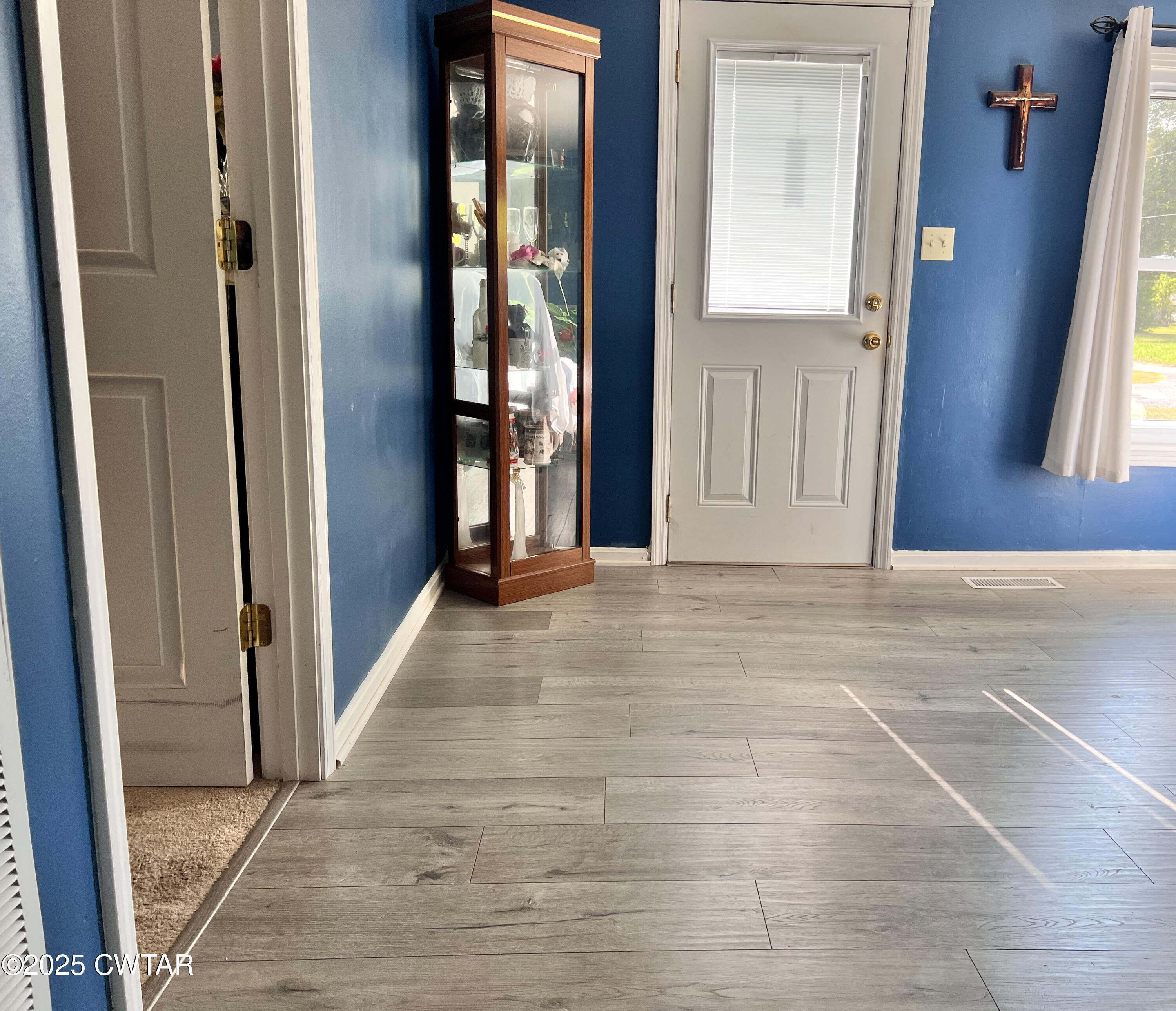 154 North Winchester Street McKenzie, TN 38201 - Photo 6 of 24 a view of a hallway with wooden floor and stairs
