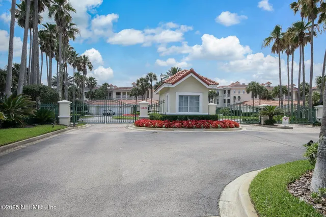 a view of kitchen with furniture and a refrigerator
