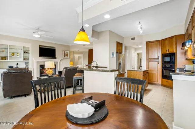 a bedroom with two beds and painting on the wall