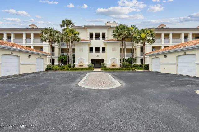 a dining room filled with furniture and chandelier
