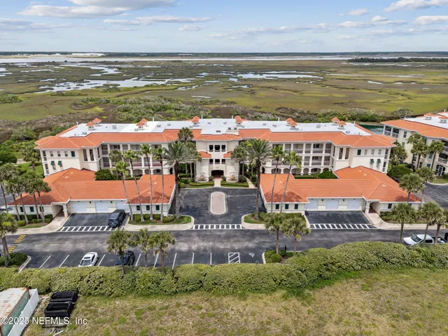 a view of a lake with houses in the back