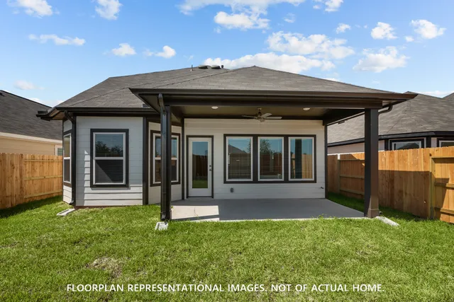 a large white kitchen with cabinets