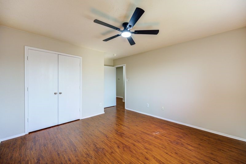 11010 Crosby Field Lane Houston, TX 77034 - Photo 8 of 15 a view of an empty room with wooden floor