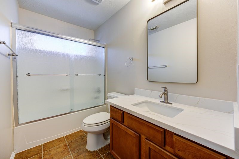 11010 Crosby Field Lane Houston, TX 77034 - Photo 10 of 15 a bathroom with a sink a toilet and shower