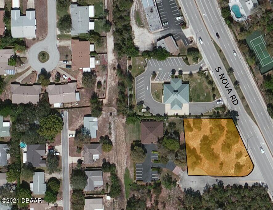 210 North Nova Road Ormond Beach, FL 32174 - Photo 3 of 4 an aerial view of residential house with pool and yard