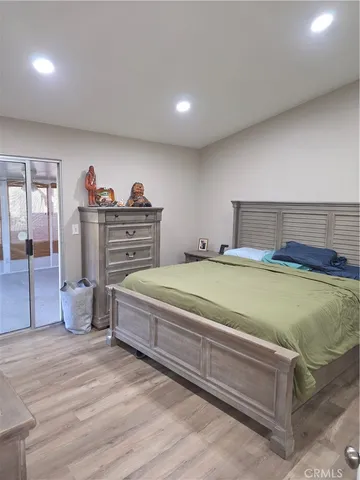 a bed room with a bed and a cabinets