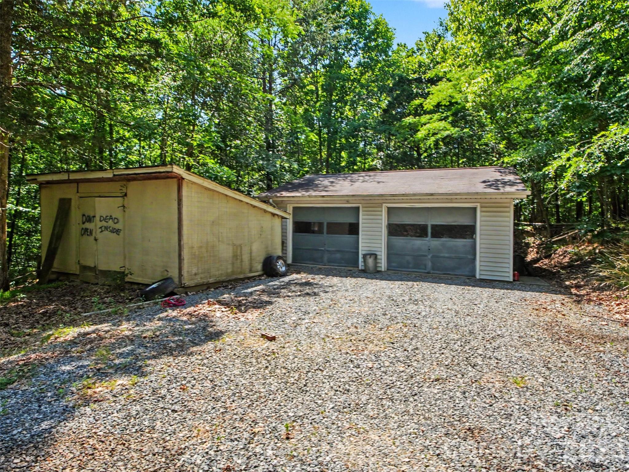 11109 Asbury Chapel Road Huntersville, NC 28078 - Photo 26 of 33 a backyard of a house with garage and window