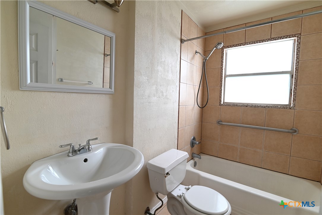 707 South 5th Street Copperas Cove, TX 76522 - Photo 12 of 19 a bathroom with a sink toilet and shower
