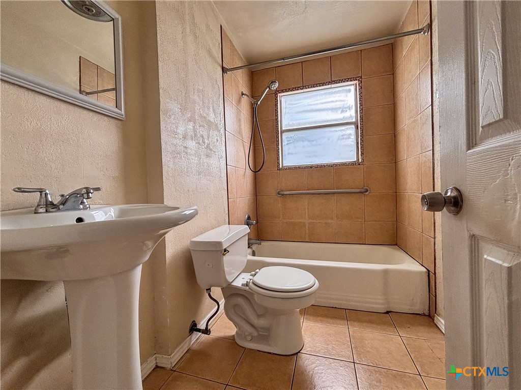 707 South 5th Street Copperas Cove, TX 76522 - Photo 13 of 19 a bathroom with a sink toilet and shower