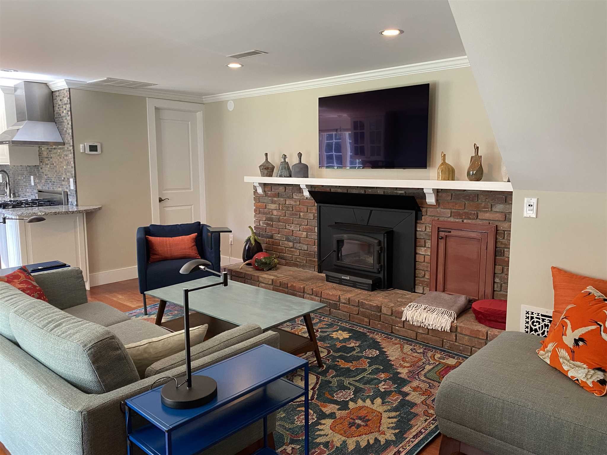 31 Robinson Road Salt Point, NY 12578 - Photo 16 of 27 a living room with furniture a flat screen tv and a fireplace