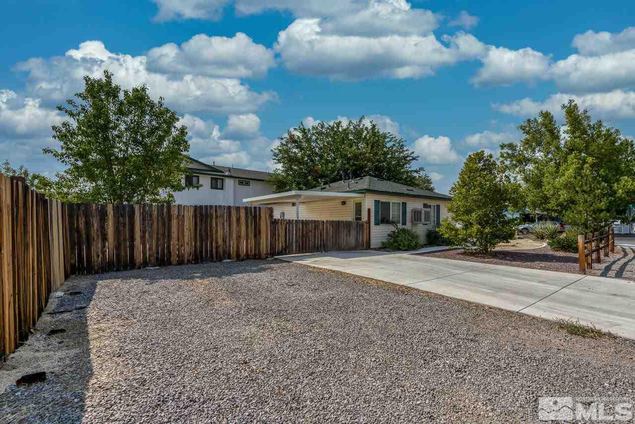 1890 Helena Avenue Reno, NV 89512 - Photo 23 of 23 a front view of a house with a yard and trees