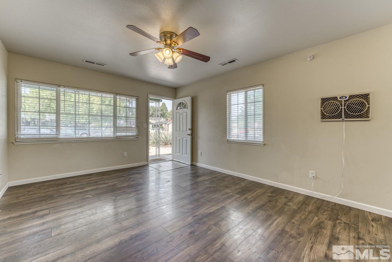 1890 Helena Avenue Reno, NV 89512 - Photo 5 of 23 a view of an empty room with a window and wooden floor