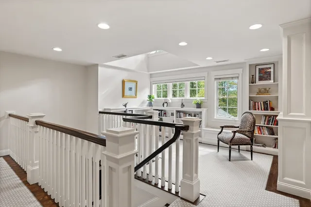 a bedroom with a bed bathtub and window