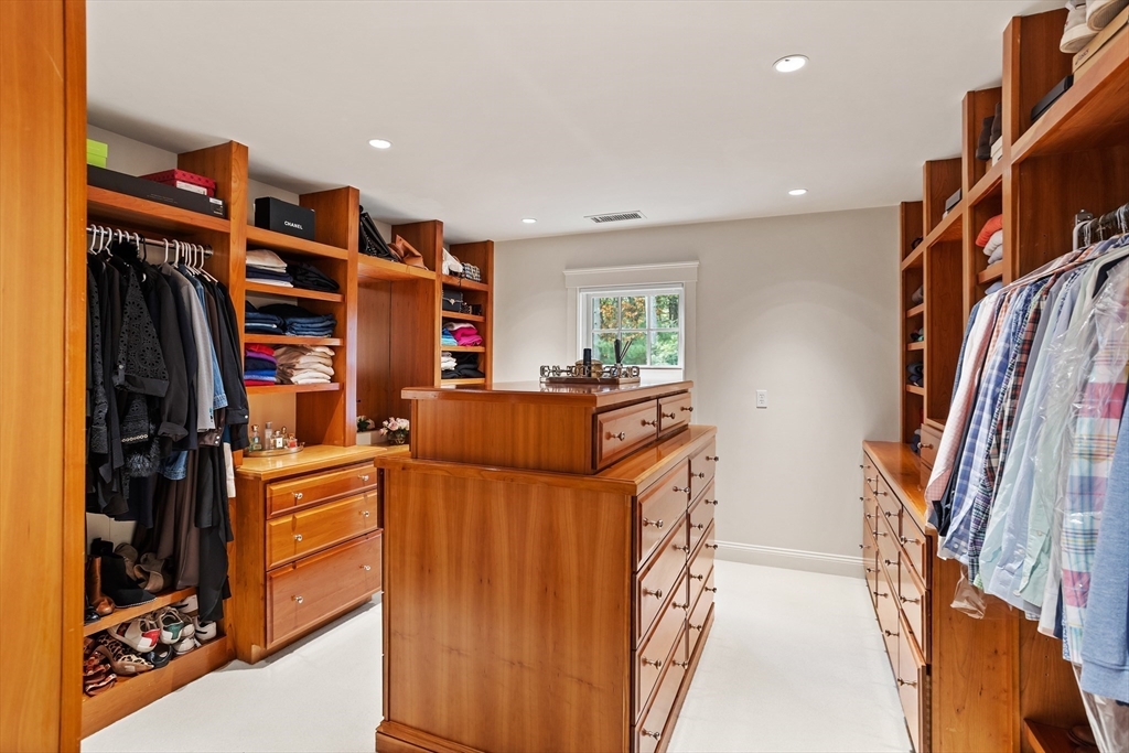 244 Musterfield Road Concord, MA 01742 - Photo 24 of 41 a view of walk in closet with clothes and shoes