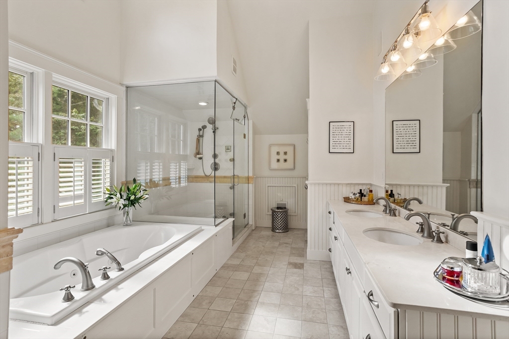 244 Musterfield Road Concord, MA 01742 - Photo 26 of 41 a spacious bathroom with a tub a sink and a large mirror