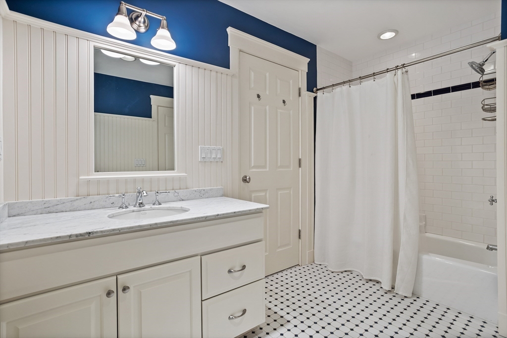 244 Musterfield Road Concord, MA 01742 - Photo 28 of 41 a spacious bathroom with a shower a sink and a mirror