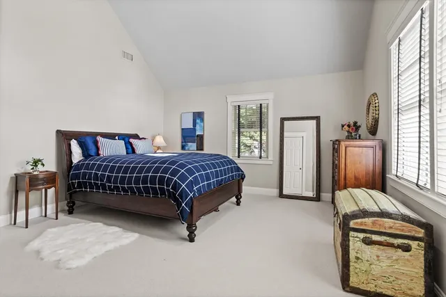 a bedroom with furniture and a window