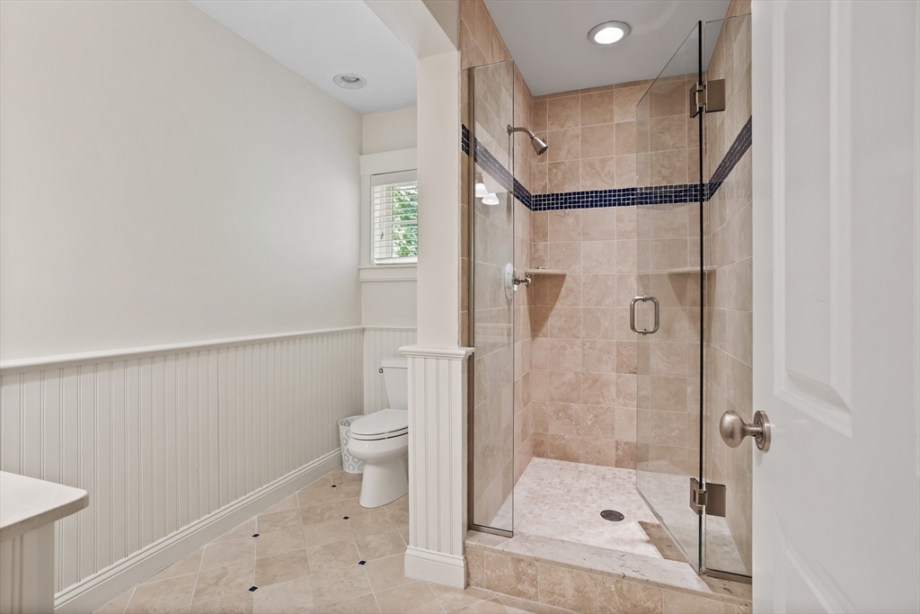244 Musterfield Road Concord, MA 01742 - Photo 31 of 41 a bathroom with a shower and toilet