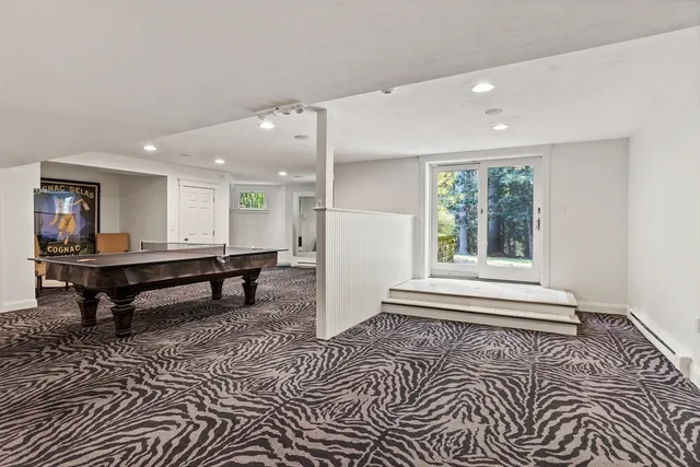 a view of a backyard with table and chairs and potted plants