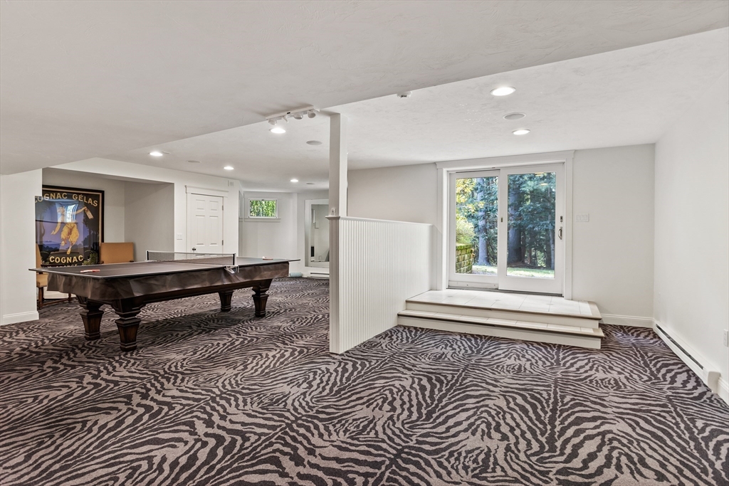 244 Musterfield Road Concord, MA 01742 - Photo 34 of 41 a room with lots of furniture and a window