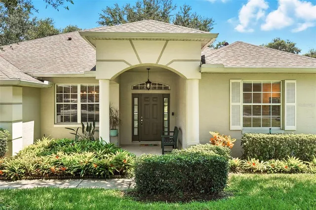 front view of a house with potted plants