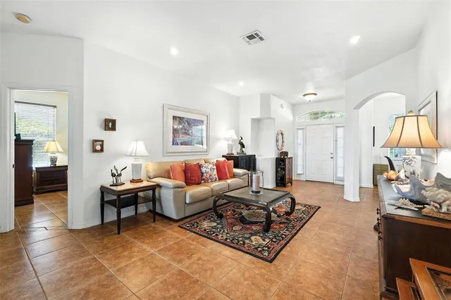 a living room with furniture rug and window