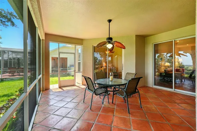 a outdoor dining space with furniture and garden view